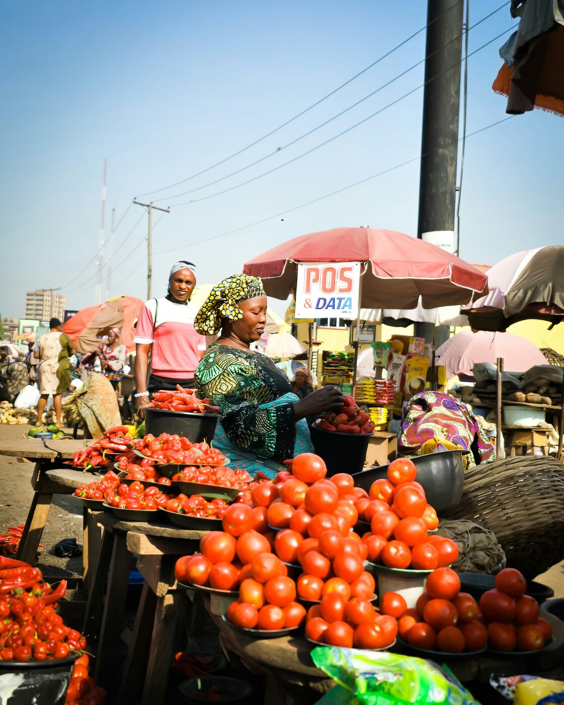 A busy community market with fresh produce